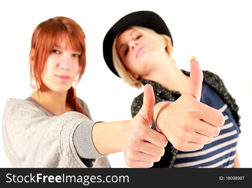 Two girls making the thumbs up gesture. Two girls making the thumbs up gesture