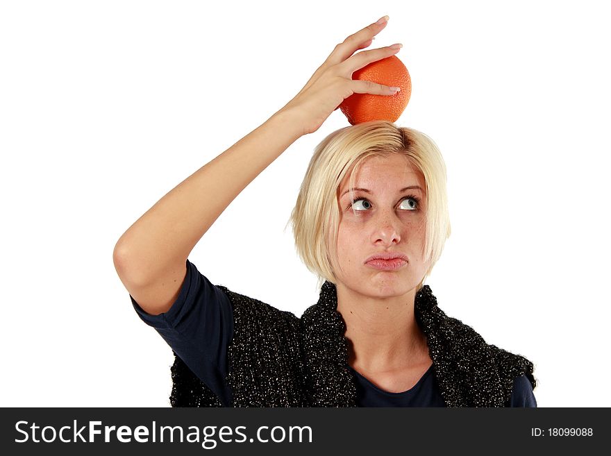 An blond girl holding an orange. An blond girl holding an orange