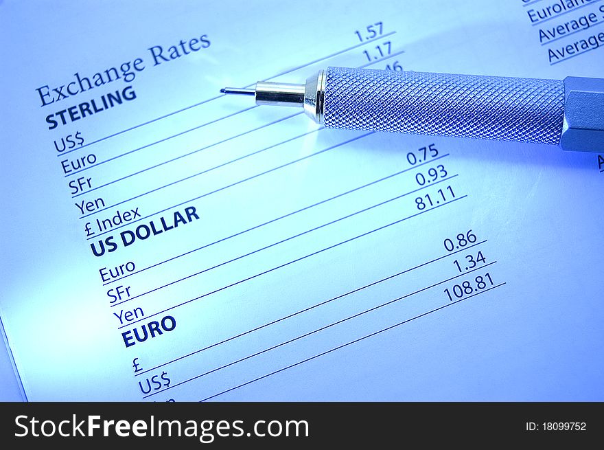 Close-up of stylish pencil highlighting exchange rate data. Cast light focuses on US Dollar & Euro. Close-up of stylish pencil highlighting exchange rate data. Cast light focuses on US Dollar & Euro.