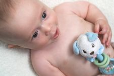 Baby With Rattle Stock Image