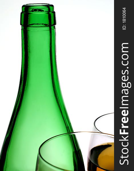Green bottle and two glasses on white background. Green bottle and two glasses on white background.