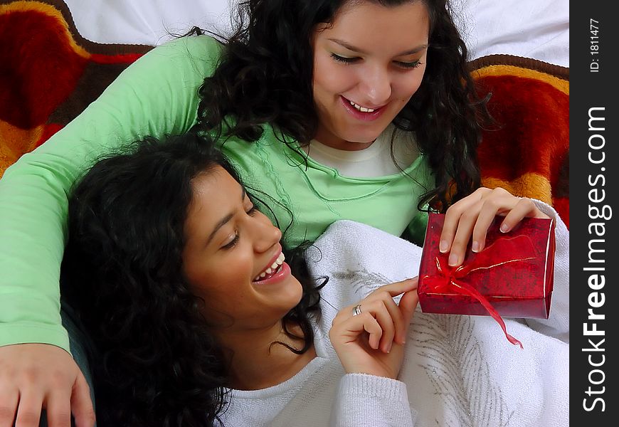 Two beautiful girls with gifts