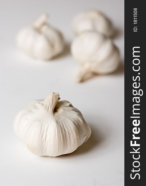 Four garlics ob white background