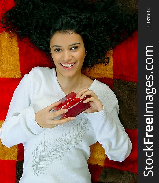 Young beautiful girl with gift