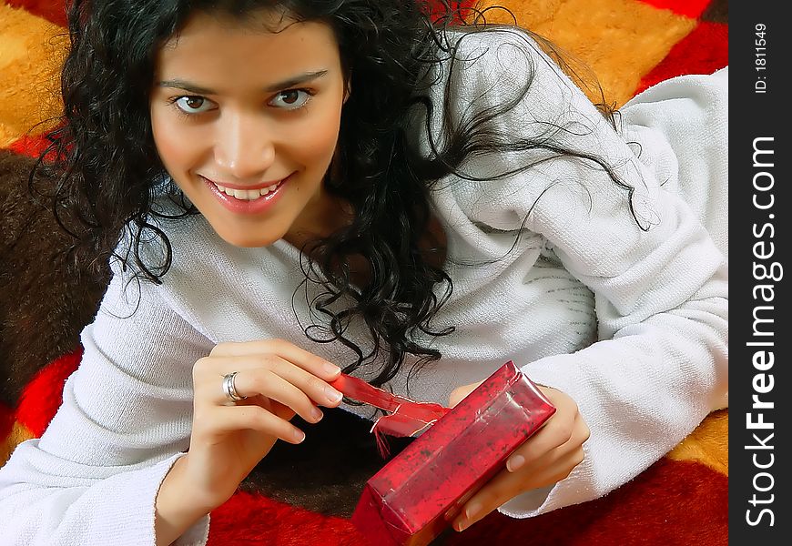 Young beautiful girl with gift