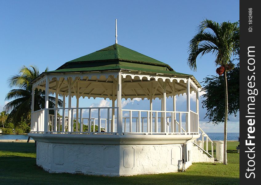 Gazebo bandstand on tropical island at sunrise