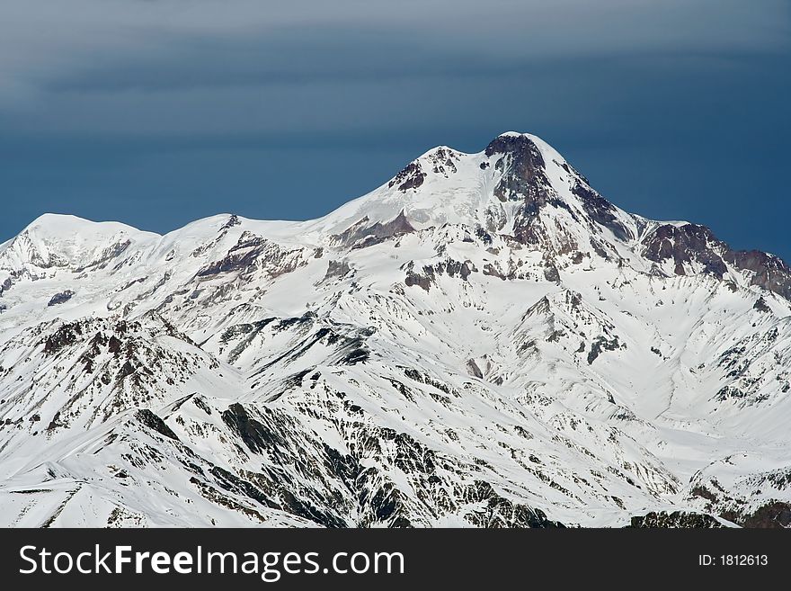 Mountain Kazbek (5047m) in Georgia.  View is from Sutzelly Mountain. Mountain Kazbek (5047m) in Georgia.  View is from Sutzelly Mountain.