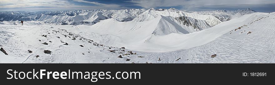 Mountain peaks in Georgia, near Gudauri ski resort.  Panoramic view is from Sutzelly Mountain. Mountain peaks in Georgia, near Gudauri ski resort.  Panoramic view is from Sutzelly Mountain.