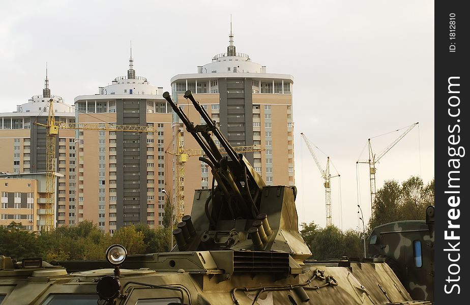 Gun of military vehicle against buildings in Kiev. Gun of military vehicle against buildings in Kiev