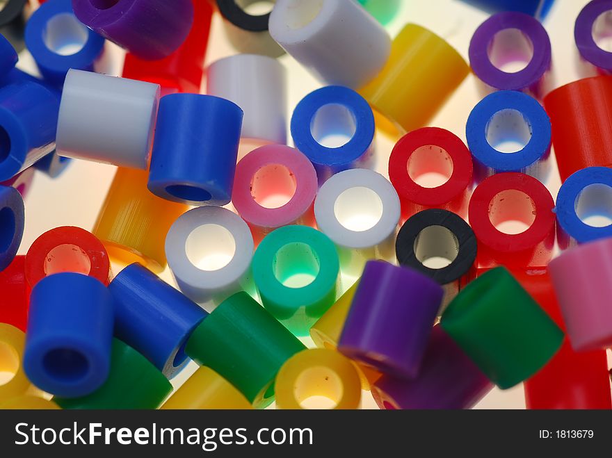 Small color plastic toy cylinders