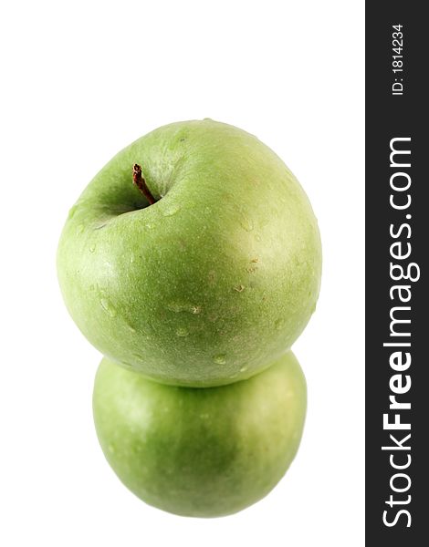 Green apple on top of another green apple. Green apple on top of another green apple