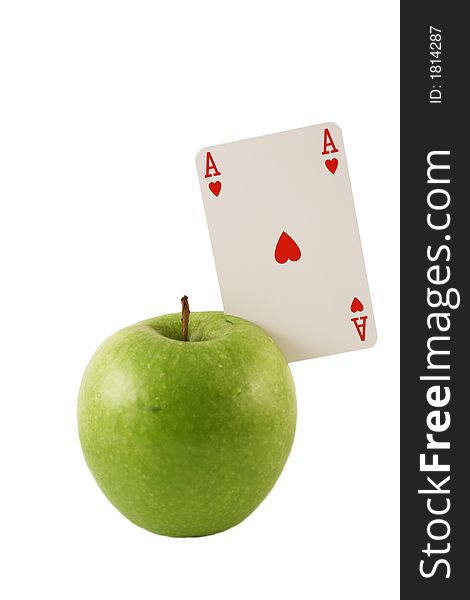 Green apple with the ace of hearts on a white background