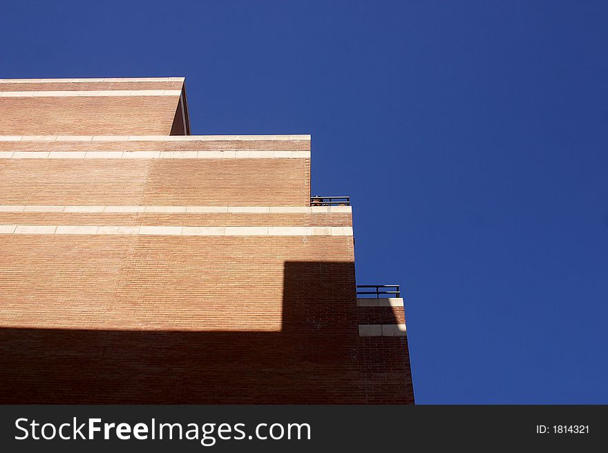 Line painted on the blue sky by a building at the city of Barcelona, Catalunya, Spain, Europe