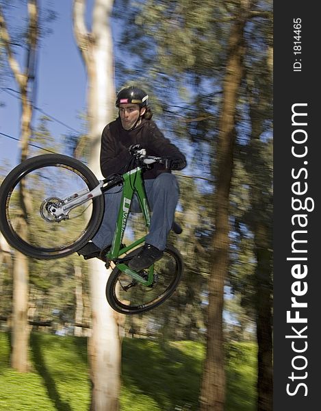 Panning of a rider flying in table top. Panning of a rider flying in table top