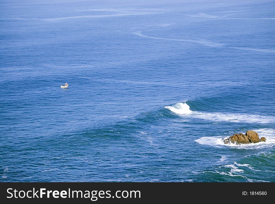 Small fishing boat in the big atlantic ocean. Small fishing boat in the big atlantic ocean