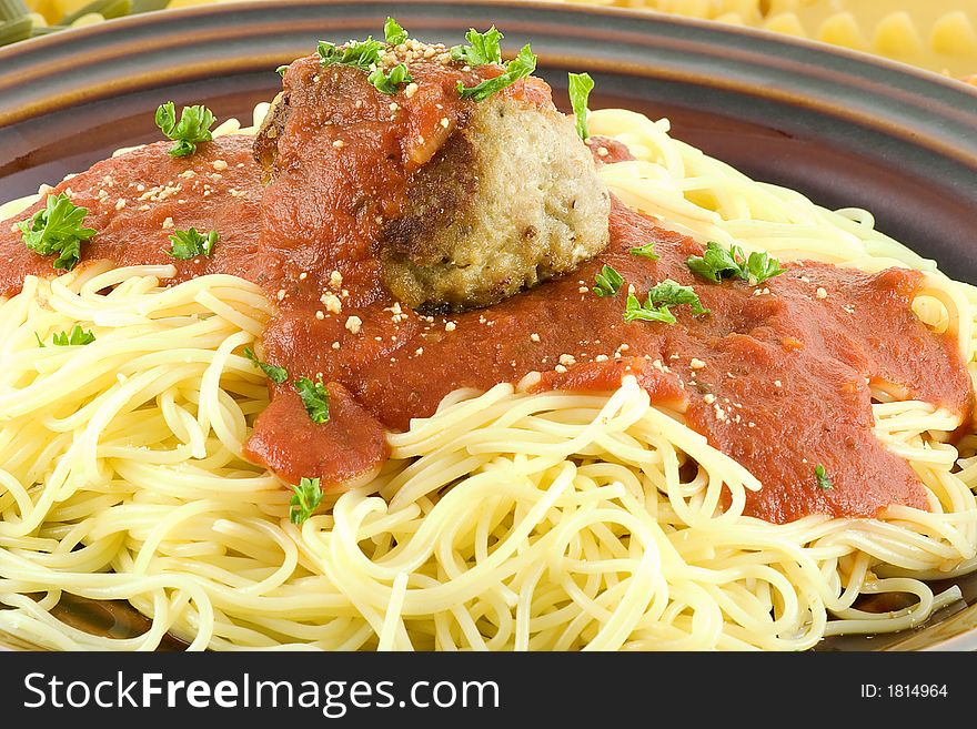 Spaghetti with a turkey,meat ball and sauce on a bed of many types of pastas available for our use. Spaghetti with a turkey,meat ball and sauce on a bed of many types of pastas available for our use.