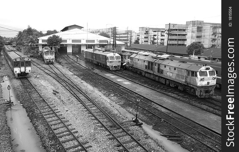 Trains at the railway station of Had Yai in the south of Thailand on a rainy day. Black and white photo. Trains at the railway station of Had Yai in the south of Thailand on a rainy day. Black and white photo.