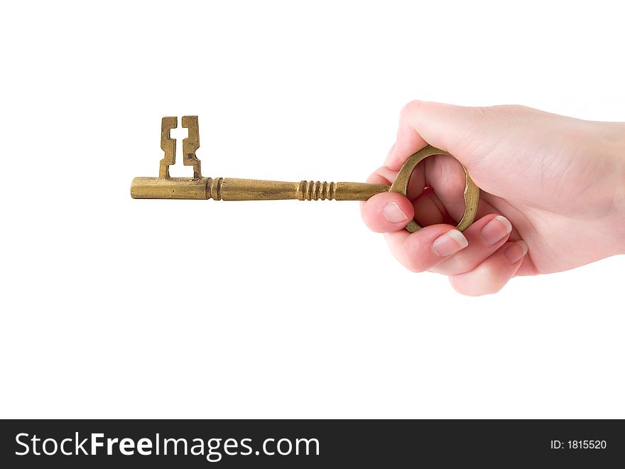 A hand turning a key against a white background. A hand turning a key against a white background.