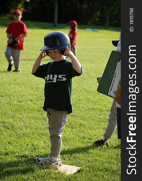 Five year old boy playing baseball. Five year old boy playing baseball.