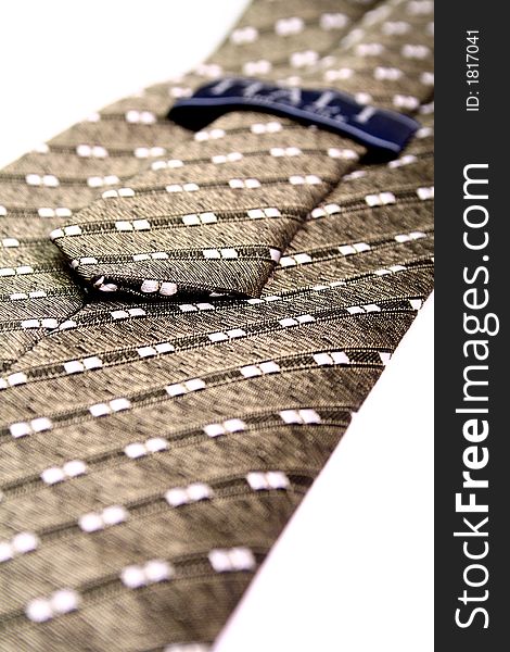 Tie of the businessman with a simple pattern - it is made in Italy, isolated on white, (look similar images in my portfolio). Tie of the businessman with a simple pattern - it is made in Italy, isolated on white, (look similar images in my portfolio)