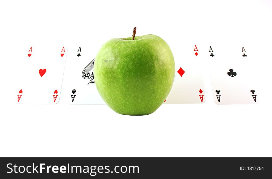 Green apple with aces on a white background