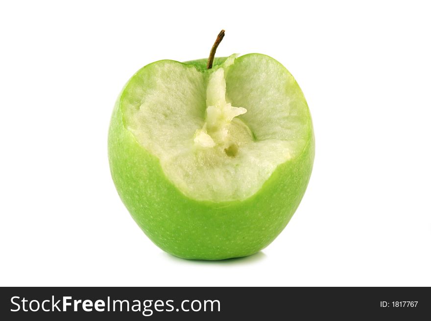 Bited green apple on a white background