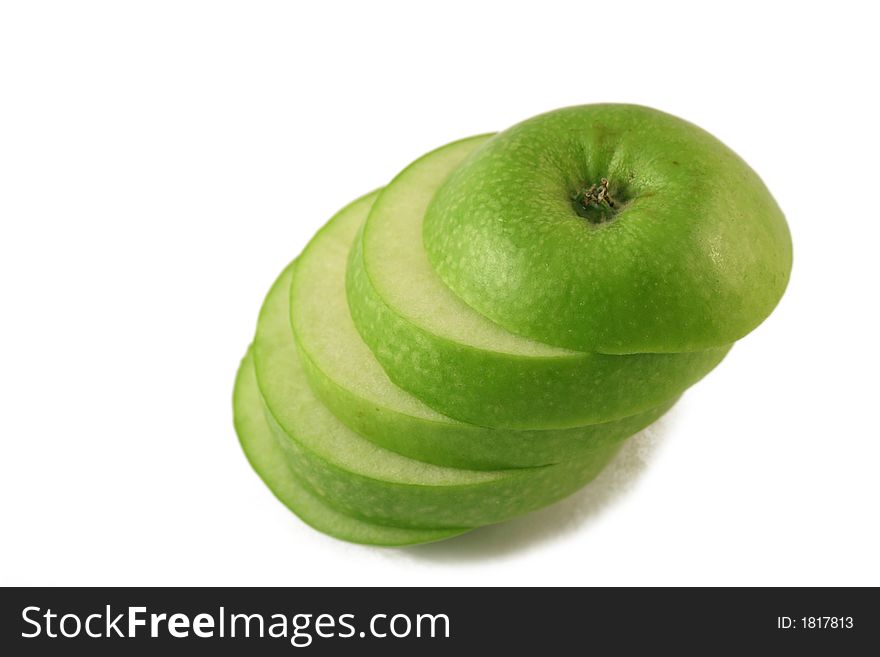 Green apple slices on a white background