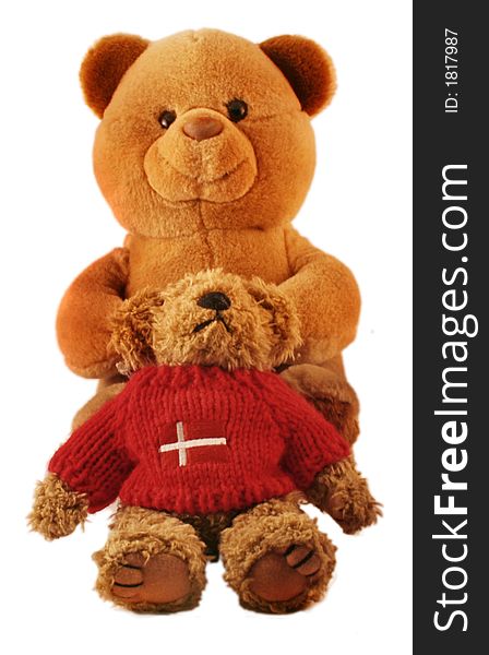 Two teddy bears holding each other. The small one has a Denmark sign. Two teddy bears holding each other. The small one has a Denmark sign