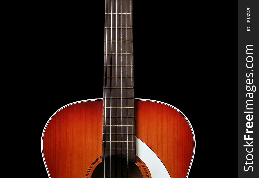 Acoustic guitar on black background. Macro. Close up. Acoustic guitar on black background. Macro. Close up.