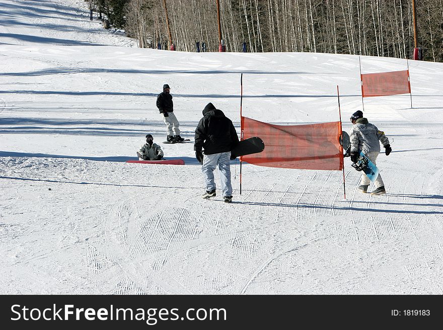 People snow boarding on snow
