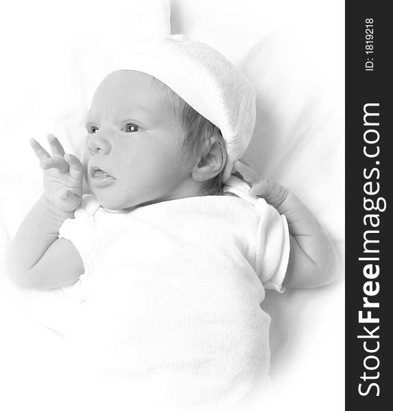 Infant laying on a white background. Infant laying on a white background.