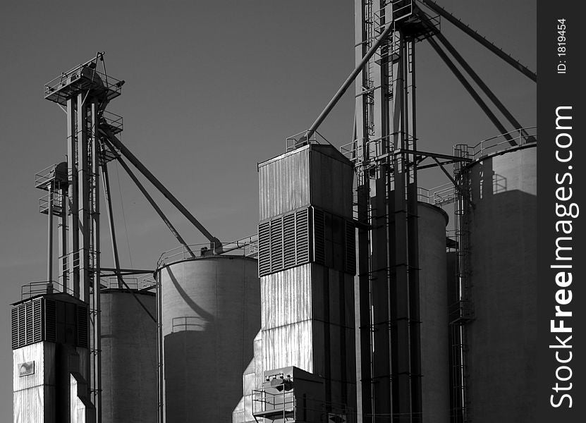 Black and white grain silos.