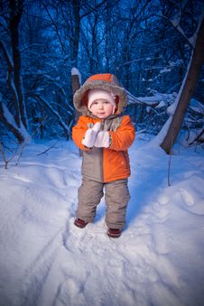 Baby Walking In Park. Putting On Mittens Royalty Free Stock Photography Baby Walking In Park. Putting On Mittens Royalty Free Stock Photography