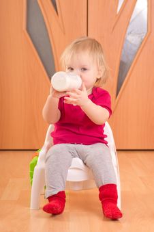 Adorable Baby Sit On Baby Chair And Drink Milk Royalty Free Stock Images Adorable Baby Sit On Baby Chair And Drink Milk Royalty Free Stock Images