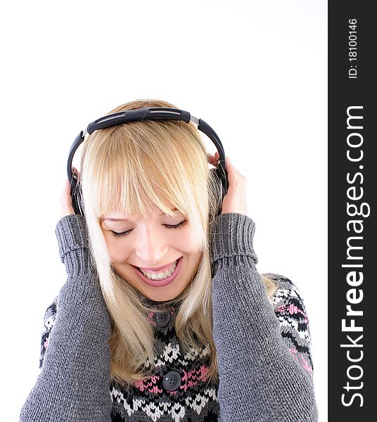 Pretty blond smiling and listening to music. Pretty blond smiling and listening to music