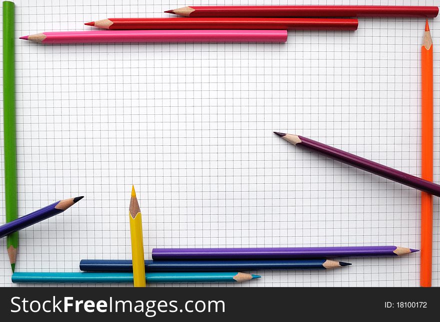 Colorful pencils frame on blank paper sheet