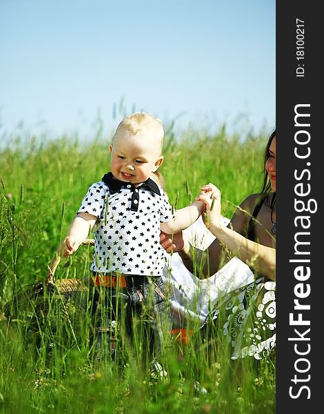 Happy family on picnic in green grass. Happy family on picnic in green grass