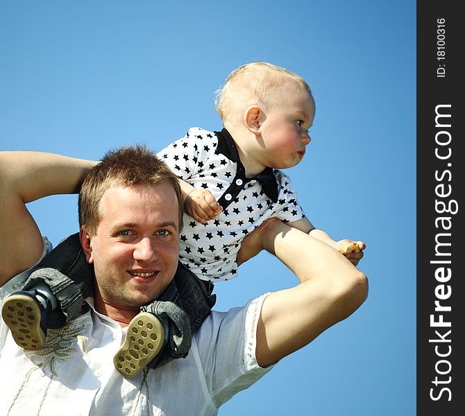 Father and son in blue sky