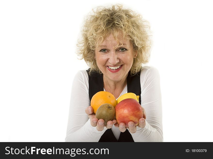 Isolated studio portrait of best age female with fresh fruits in hands. Isolated studio portrait of best age female with fresh fruits in hands