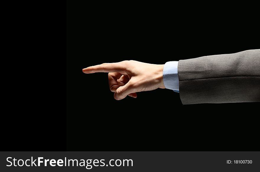 Poiniting businessman hand, isolated on black