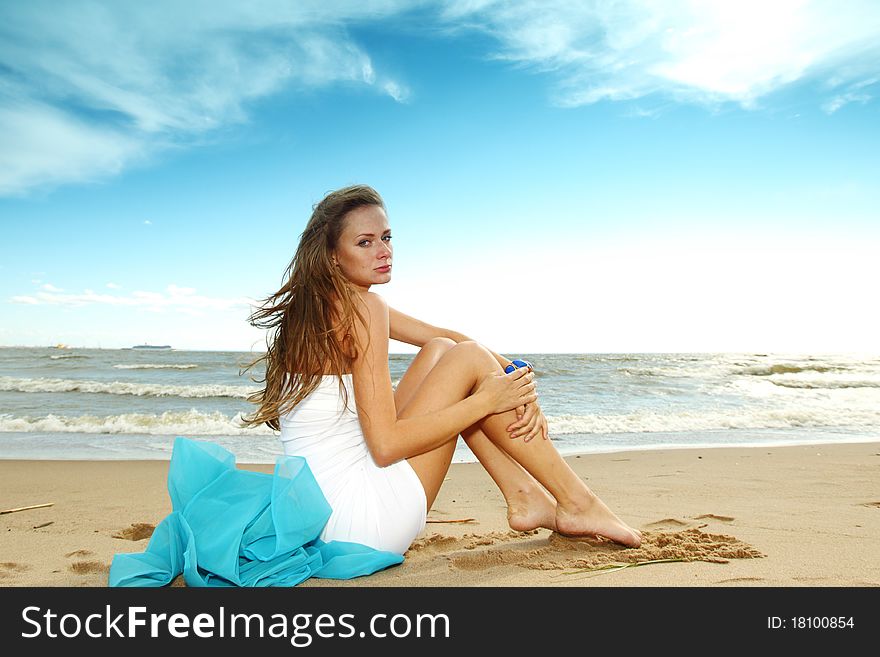 Woman laying on sand sea on background. Woman laying on sand sea on background
