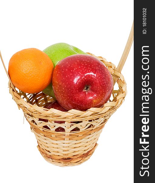 Wicker basket with apples, white background, isolated