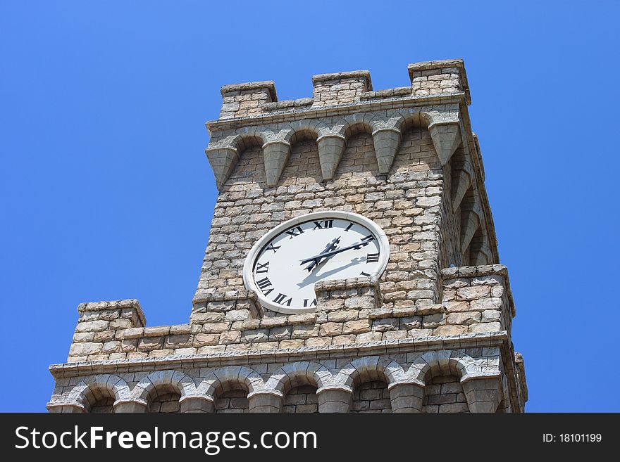 A Venetian style Clocktower against clear blue sky
