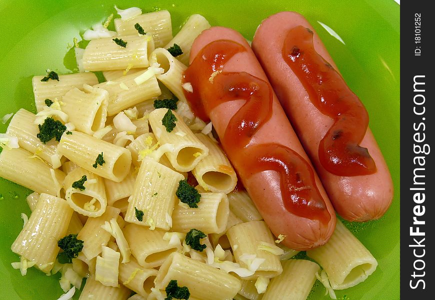 Delicious sausage with pasta isolated on white