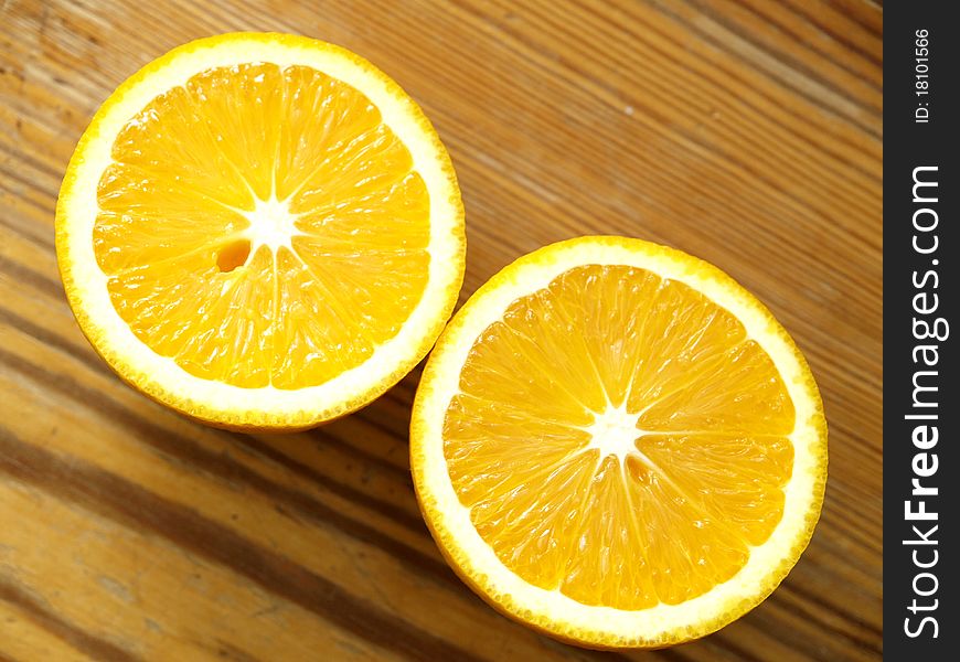 Orange slices on a wooden table. Orange slices on a wooden table