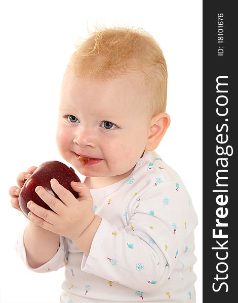 Portrait of a beautiful child with a red apple on a white background