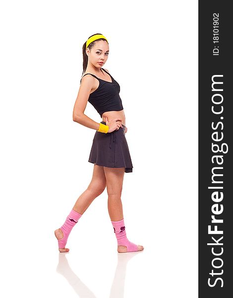 Photo of a young girl doing a fitness exercises. Photo of a young girl doing a fitness exercises