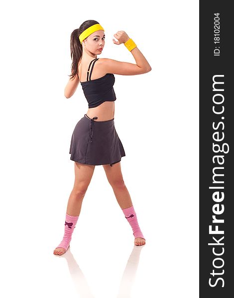 Photo of a young girl doing a fitness exercises. Photo of a young girl doing a fitness exercises