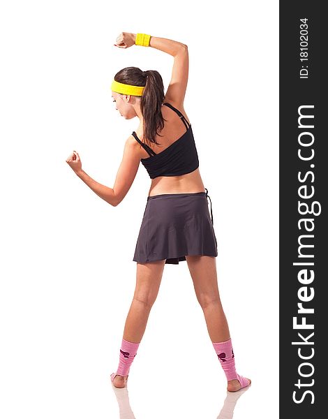 Photo of a young girl doing a fitness exercises. Photo of a young girl doing a fitness exercises