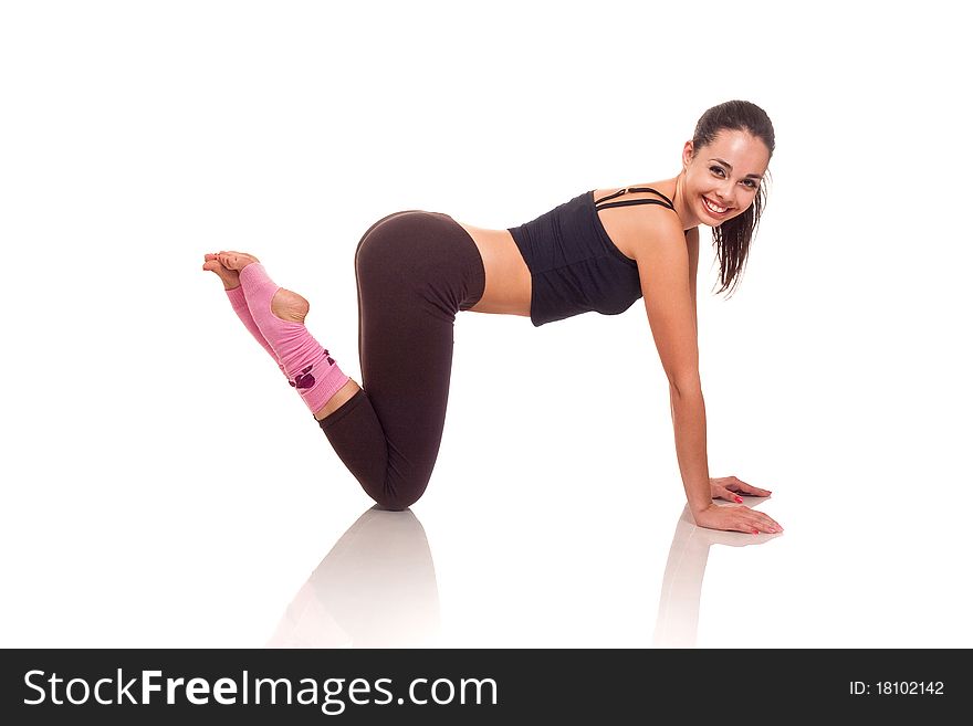 Photo of a young girl doing a fitness exercises. Photo of a young girl doing a fitness exercises